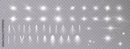 Set of white light spotlights, flashes of light on a transparent background. Vector glowing light effect.	