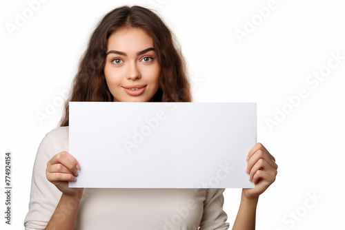 Portrait of a beautiful young woman holding a blank sheet of paper