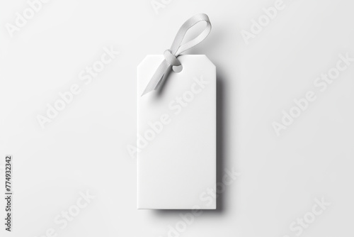 white cardboard hangtag for products or gift tag mockup with ribbon on white background