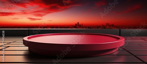 red podium on the background of the city at sunset.
