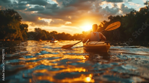 Tourists kayaking on the river sunset Surrounded by water Clouds and tranquil nature in the sun reflecting the sunset on the river and discovering wild nature.