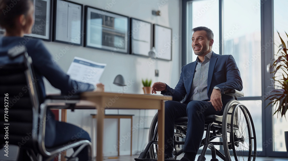 Man in a suit sitting in a wheelchair in a corporate environment, inclusion.

