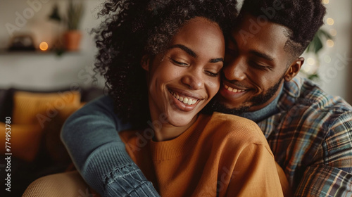 Happy african american couple hugging while sitting on sofa at home. AI.