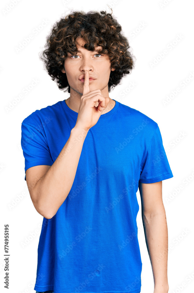 Caucasian teenager wearing casual clothes asking to be quiet with finger on lips. silence and secret concept. Caucasian teenager wearing casual clothes asking to be quiet with finger on lips. silence and secret concept.