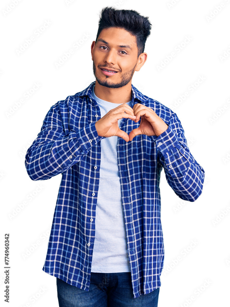 Handsome latin american young man wearing casual shirt smiling in love showing heart symbol and shape with hands. romantic concept. Handsome latin american young man wearing casual shirt smiling in love showing heart symbol and shape with hands. romantic concept.