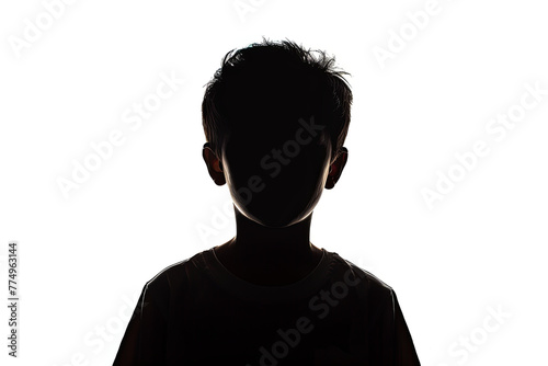 A dark silhouette figure of young boy on white background, with unclear face feature photo