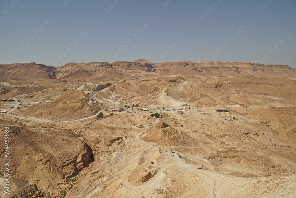 Drone shot of Masada with rocky ancient fortress and mountains in Israel Drone shot of Masada with rocky ancient fortress and mountains in Israel