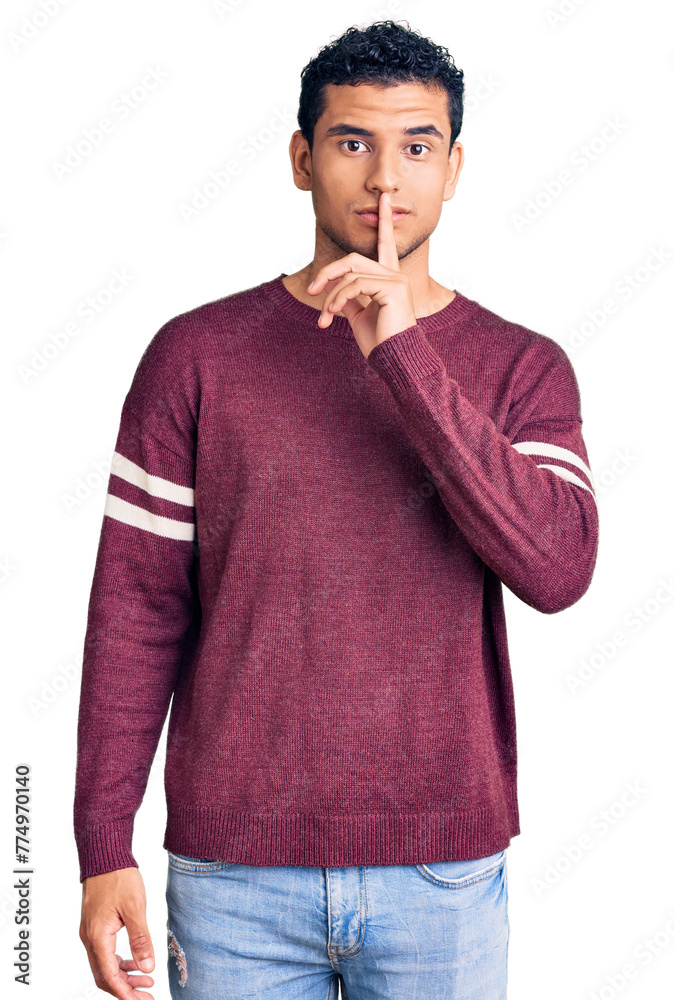 Hispanic handsome young man wearing casual clothes asking to be quiet with finger on lips. silence and secret concept. Hispanic handsome young man wearing casual clothes asking to be quiet with finger on lips. silence and secret concept.