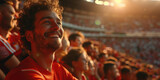 a fan in a red jersey experiences a moment of joy in a noisy stadium