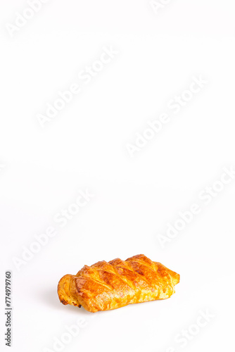 Puff pastry with a crispy golden crust isolated on a white background photo