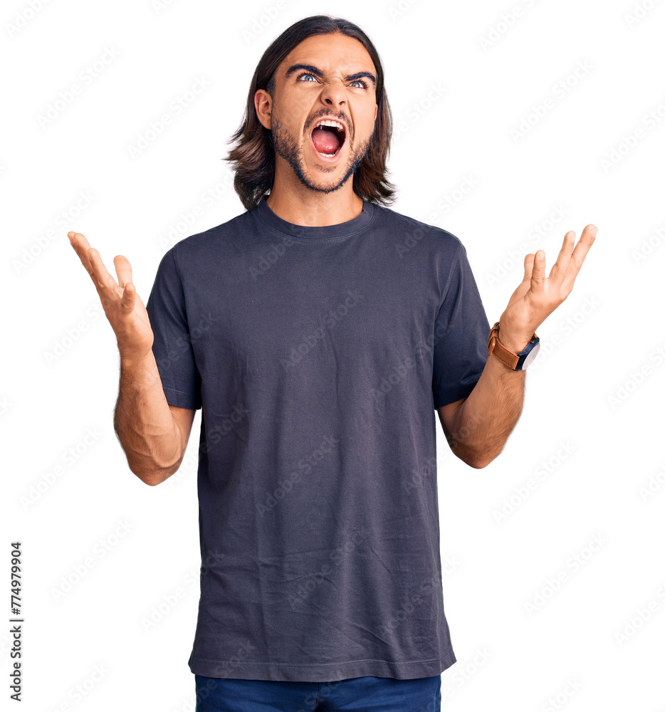 Young handsome man wearing casual clothes crazy and mad shouting and yelling with aggressive expression and arms raised. frustration concept. Young handsome man wearing casual clothes crazy and mad shouting and yelling with aggressive expression and arms raised. frustration concept.