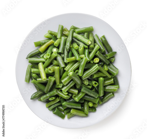 Green beans in a plate on a white background. Top view