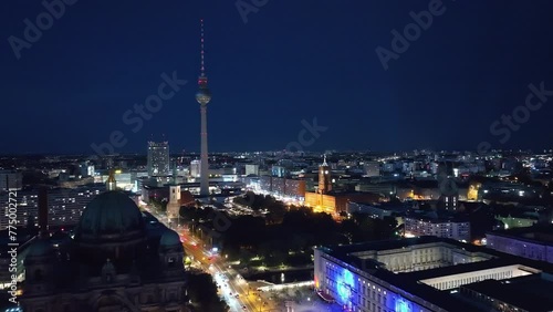 Aerial drone view of Alexanderplatz at night . Berlin city centre , Germany .  photo