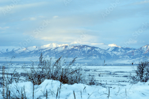Cold snowy mountain landscape at sunset. © Anna