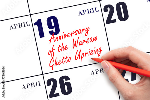 April 19. Hand writing text Anniversary of the Warsaw Ghetto Uprising on calendar date. Save the date.