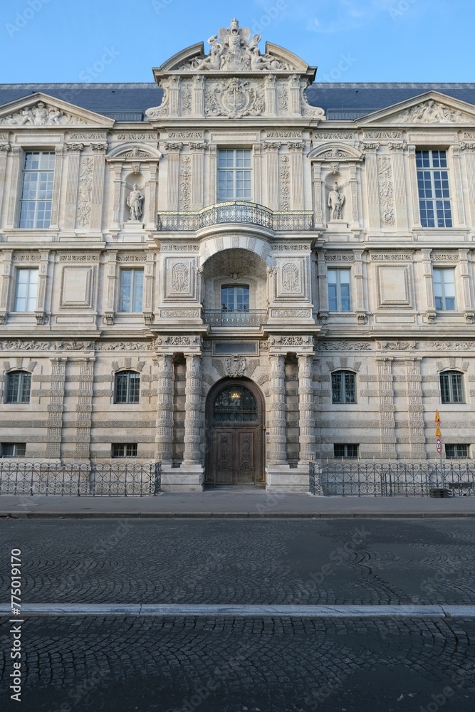 Naklejka premium Vertical shot of the famous Louvre museum in Paris, France