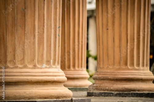 Closeup of beige columns with texture outdoors