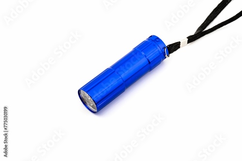 Closeup of a blue flashlight isolated on a white background