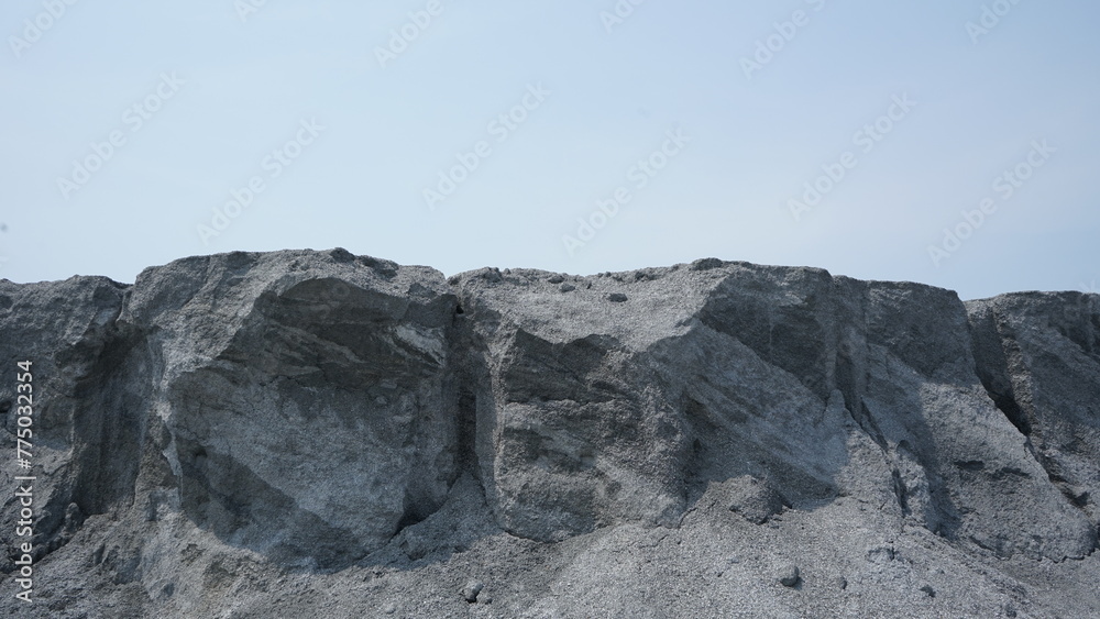 Fototapeta premium A gray volcanic mountain on a sunny day