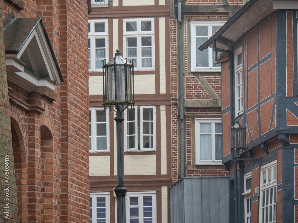 Street lamp and old European brick buildings in Stade, Germany. Street lamp and old European brick buildings in Stade, Germany.