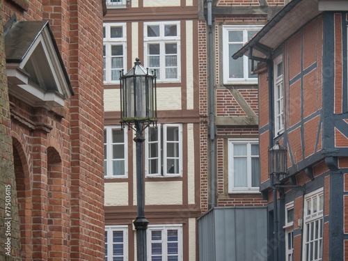 Street lamp and old European brick buildings in Stade, Germany. photo