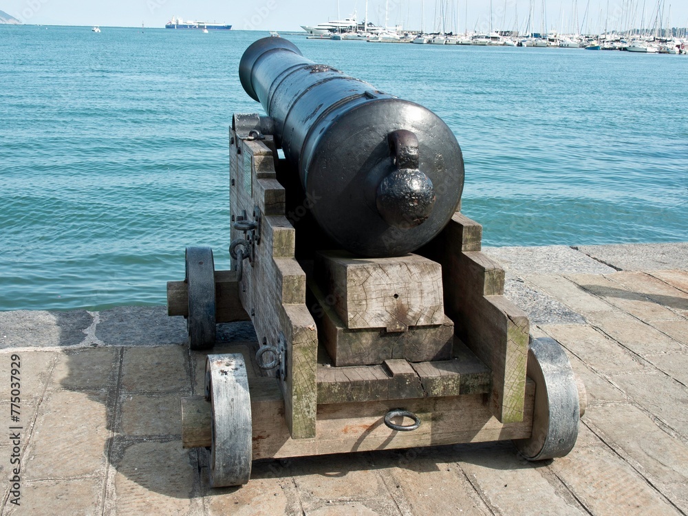 Sculpture of vintage cannon gun by the sea