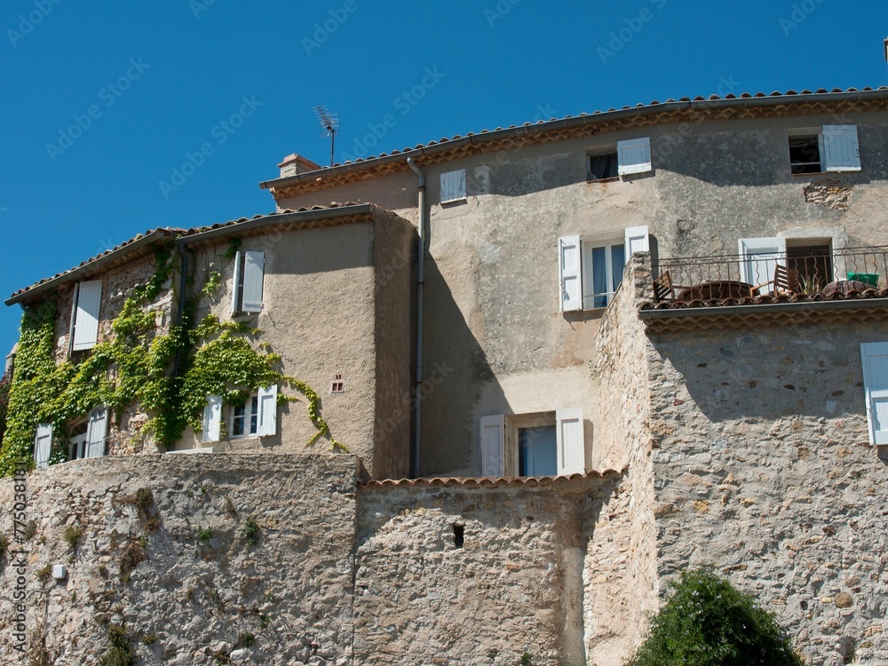 Exterior of a medieval stone traditional houses with blue sky in Le Castellet, France