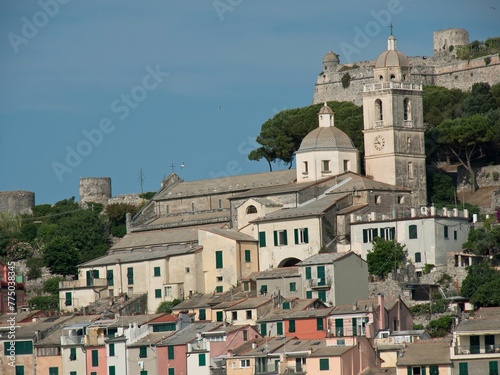 Image of several buildings on a mountain surrounded with trees in Porto Venere, Italy