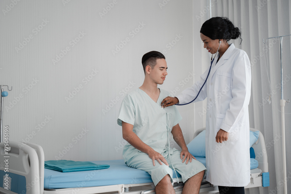 A doctor is examining a patient in a hospital room A doctor is examining a patient in a hospital room