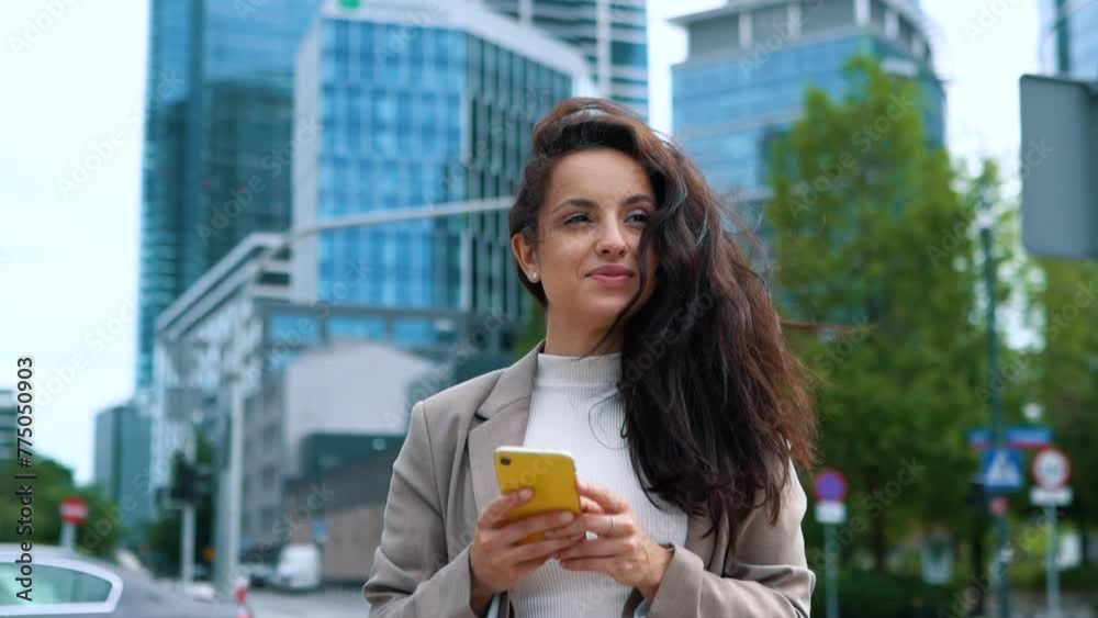 Young beautiful professional woman typing on mobile phone. Business concept Young beautiful professional woman typing on mobile phone. Business concept