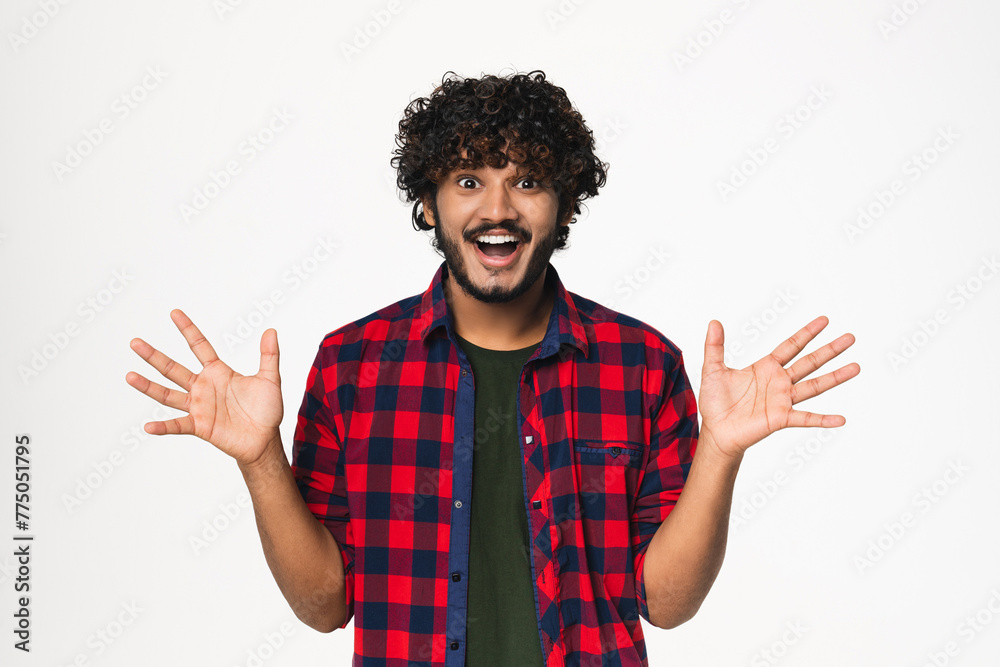 Extremely happy young Indian man expressing satisfaction isolated over white background. Cheerful Hindi boy winning lottery, betting in casino online, having jackpot Extremely happy young Indian man expressing satisfaction isolated over white background. Cheerful Hindi boy winning lottery, betting in casino online, having jackpot