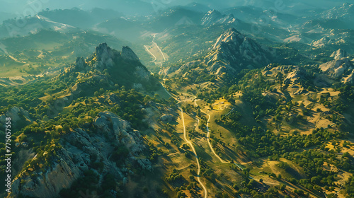 An aerial view of a network of hiking trails snaking through rugged mountain terrain