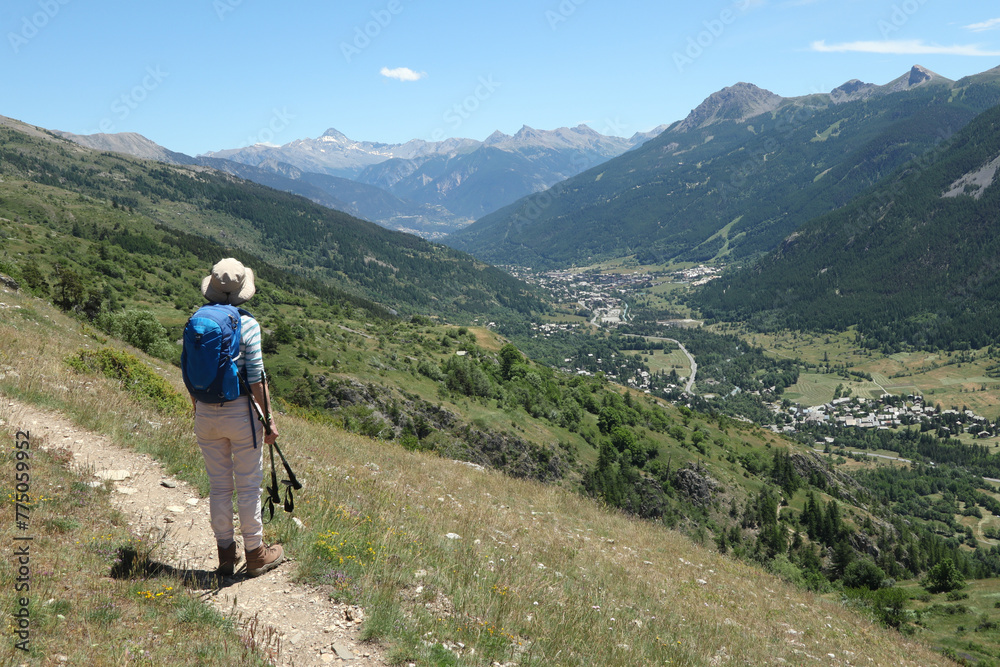 Hiker on a path in the Ecrins National Park.