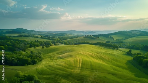 An aerial view of a picturesque countryside with rolling hills and farmland