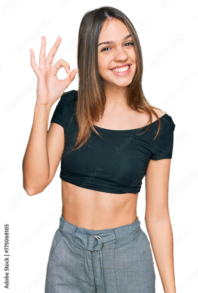 Young brunette woman wearing casual clothes smiling positive doing ok sign with hand and fingers. successful expression. Young brunette woman wearing casual clothes smiling positive doing ok sign with hand and fingers. successful expression.
