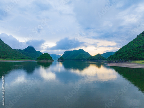 Summer lake in Oriental Guilin, Hainan, China, is burning with clouds