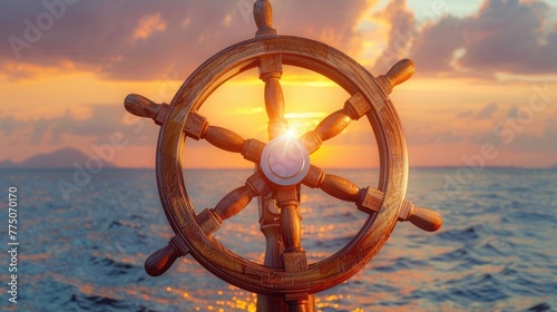 Ship's steering wheel against sunset over the ocean
