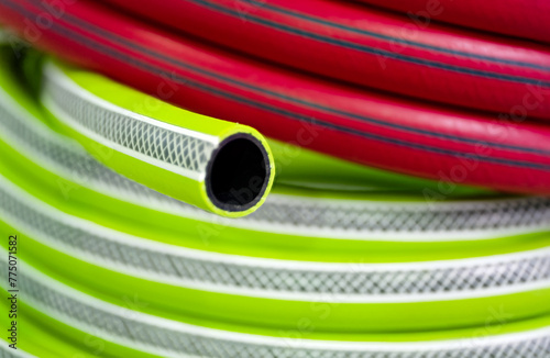Rolled up colourful garden hose