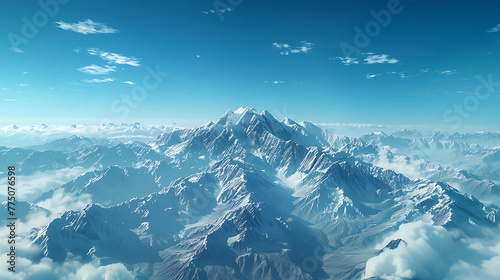 An aerial view of a snow-capped mountain range stretching to the horizon