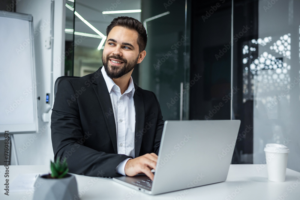 busy business man typing on laptop computer working online at desktop in the office Concentrated entrepreneur takes responsible approach to the project indoors busy business man typing on laptop computer working online at desktop in the office Concentrated entrepreneur takes responsible approach to the project indoors
