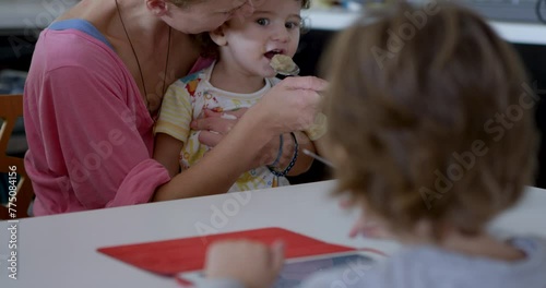 Young boy engages in morning conversation at breakfast table