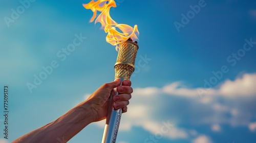 person holding the olympic torch