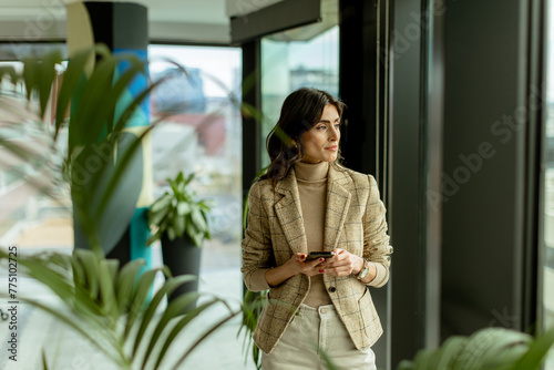 Elegant woman clad in chic ...
