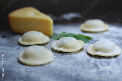 Italian Raviolli, dumplings on a wooden board (ID: 775105938)