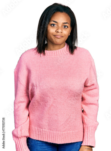 Beautiful hispanic woman wearing casual winter sweater looking sleepy and tired, exhausted for fatigue and hangover, lazy eyes in the morning.