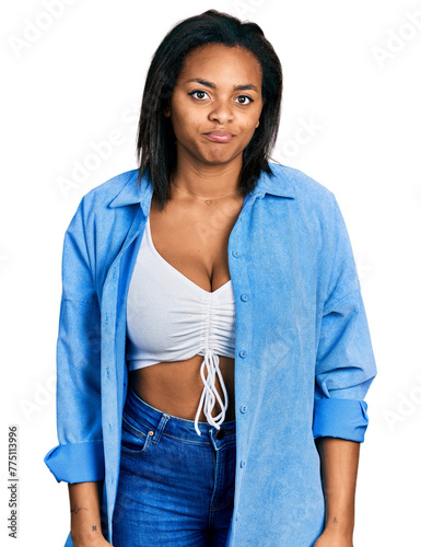 Beautiful hispanic woman wearing casual denim jacket depressed and worry for distress, crying angry and afraid. sad expression.