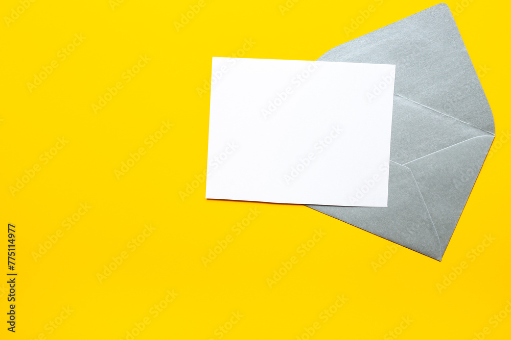Blank sheet of paper on an envelope for letters. Space for text, top view Blank sheet of paper on an envelope for letters. Space for text, top view