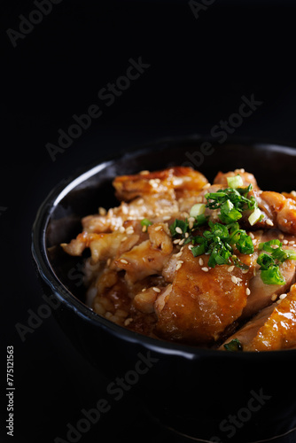 Grilled Chicken teriyaki rice Japanese food isolated in black background © Oran Tantapakul