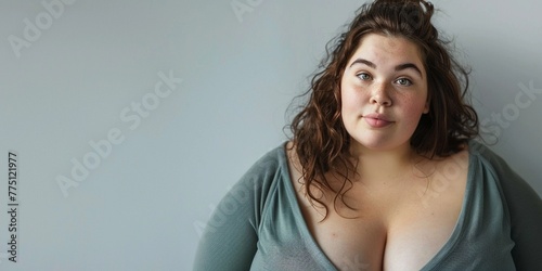 beautiful female model plus size on a simple isolated background