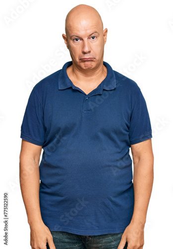 Middle age bald man wearing casual clothes depressed and worry for distress, crying angry and afraid. sad expression. © Krakenimages.com